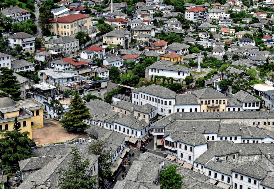 Stone-roofed houses of the old town in Gjirokastër seen from above