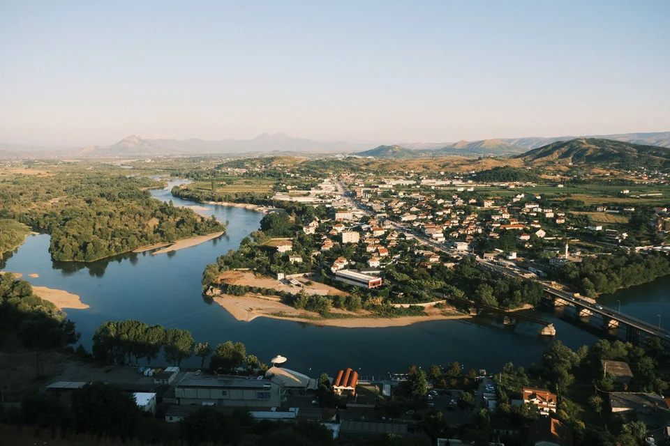 Aerial view of Shkodër and the river winding past the city