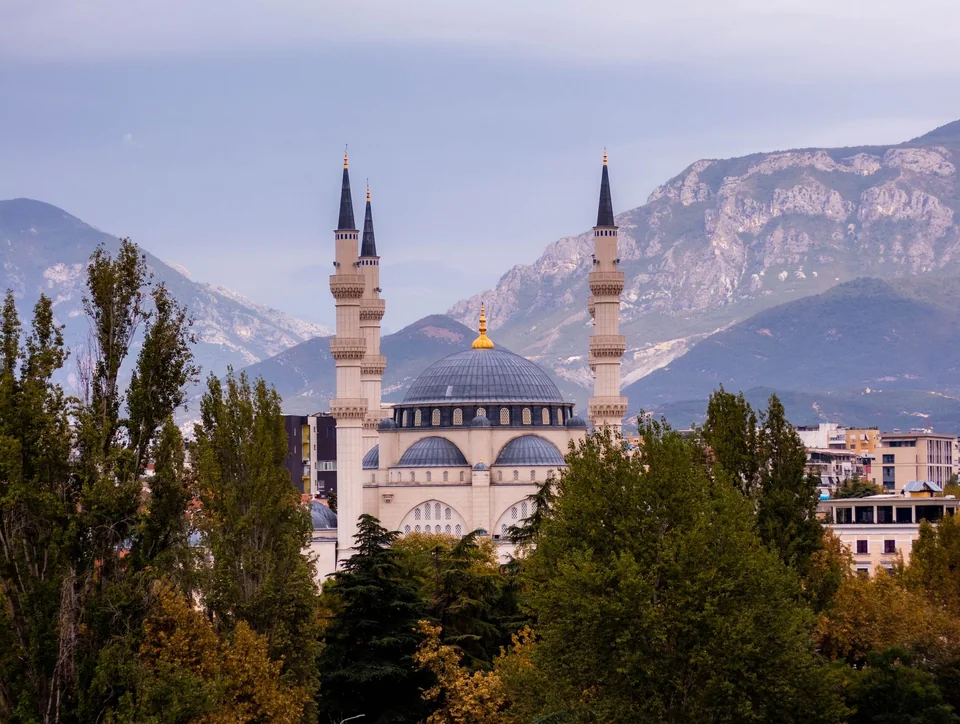 The Namazgah Mosque in Tirana with the mountains behind