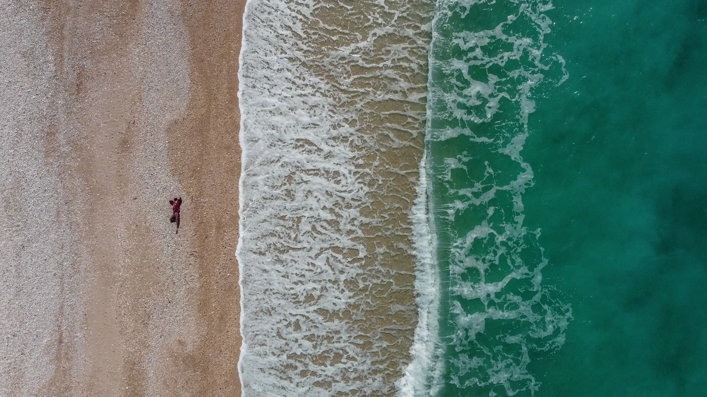 Waves breaking on Borsh beach seen from above