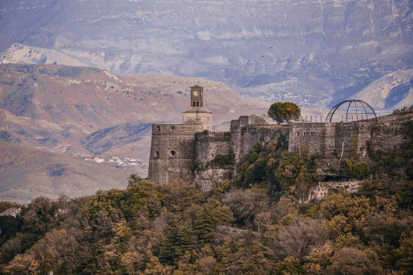 Gjirokastër Castle on its hill below the mountains